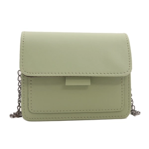 Minimalist light green faux leather crossbody square bag with fine chain strap on white background