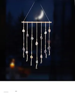 Close-up of Bohemian handmade wall hanging with natural crystals and wooden beads