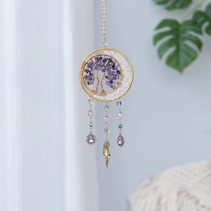 Detailed view of handmade Tree of Life suncatcher with purple crystals and gold wire mesh