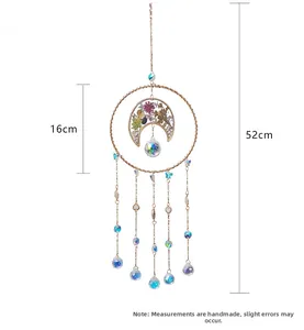 Detail of crystal suncatcher featuring purple flowers moon and golden metal butterfly chains