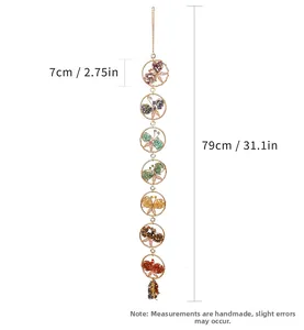 Detailed view of handmade seven chakra natural crystal butterfly hanging wall decor