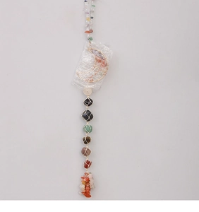 Vertical wall decor featuring golden moon frame with seven chakra healing crystal stones
