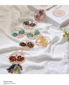 Detailed wire-wrapped butterfly suncatcher with seven chakra natural crystal stones