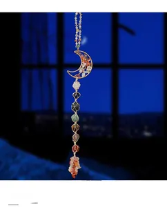 Detailed seven chakra raw stone moon ornament with tree of life wire wrap design