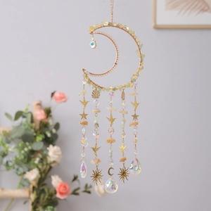 Golden moon-shaped dream catcher with citrine crystals and sun star bird pendants