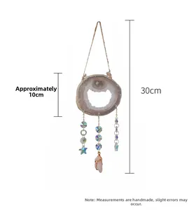 Detail of natural agate slice wind chime with crystal pendants and stars, 30cm length