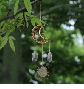 Detail of moon wire wrap wall decor with natural amethyst and crystal ornaments