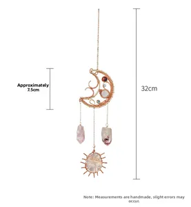 Detail of moon-shaped wind chime with natural crystals and sun agate pendant, length 32cm