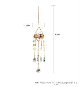 Detailed view of crystal suncatcher with golden geometric frame and size markings