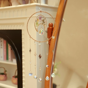 Bohemian moon crystal suncatcher with purple dried flowers and sparkling prisms