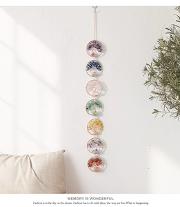 Close-up of handmade 7 chakra tree of life wall hanging with colorful natural stones