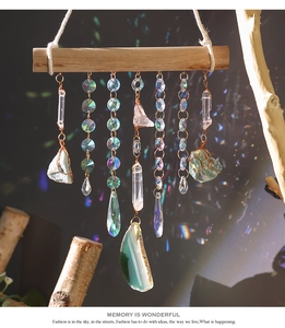 Detail of bohemian handmade crystal wall hanging with natural agate slices and dreamcatcher style
