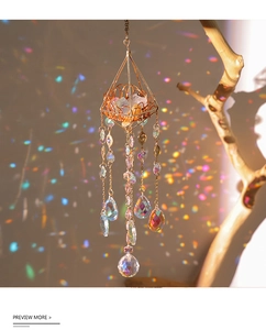 Detail of crystal suncatcher with gold frame casting rainbow light on the wall