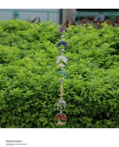 Detail of Seven Chakra Tree of Life wall hanging with woven wire and colorful crystals