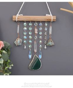Detail of natural crystal pillars and raw stone wall hanging with bohemian copper wire wrap