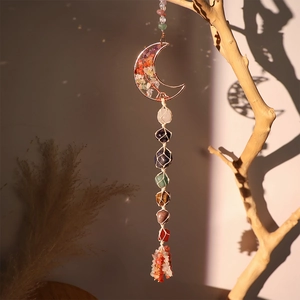 Bohemian Tree of Life moon ornament with 7 chakra raw stones in woven net hanging on a branch