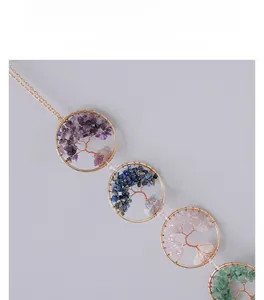 Detail of handmade Tree of Life wind chime with crystal stones in Nordic style
