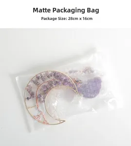 Detail of amethyst crescent moon crystal suncatcher inside frosted packaging bag