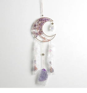 Detail of amethyst moon sun catcher with handmade wire tree and raw crystal pendants