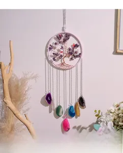 Macro detail of Tree of Life crystal suncatcher with colorful natural agate slices