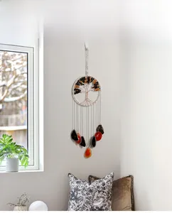 Detail of tree of life suncatcher with agate slices and polished crystal stone accents