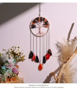 Detail of tree of life wind chime with crystal chips and hanging agate slices