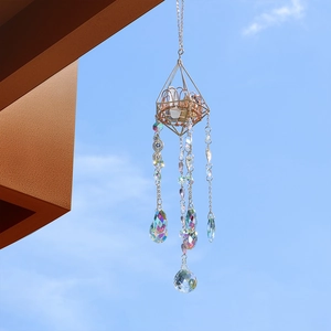 Golden geometric crystal suncatcher with raw stones and prismatic droplets for garden decor