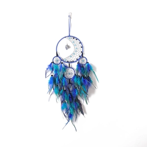 Handmade dream catcher with blue feathers and crystal stones for wall hanging decoration