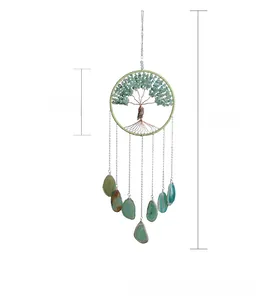 Detail view of tree of life dream catcher with green agate stones and owl pendant
