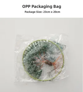 Detail of tree of life suncatcher with green stones in an OPP bag showing 23cm packaging