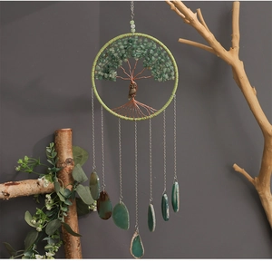 Detail of Tree of Life dream catcher with green crystals, owl charm and agate slices