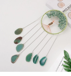Detail of Tree of Life dream catcher with green agate slices and owl pendant