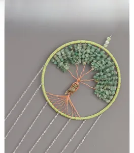 Detail of Tree of Life dream catcher with green natural stones and owl pendant charm
