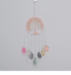Detail of Tree of Life suncatcher with natural pink crushed stones and hanging crystals