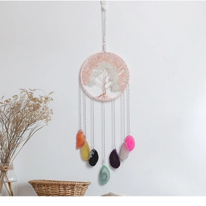 Macro detail of handmade Tree of Life dreamcatcher with colorful natural agate slices