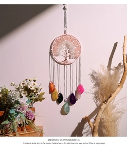Detail view of tree of life suncatcher with crystal stones and colorful agate slices