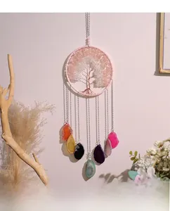Detail of Tree of Life suncatcher featuring pink crystals and natural agate slices