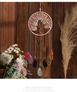 Detail of life tree suncatcher with natural pink quartz and hanging agate slices