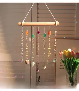 Detail of colorful crystal suncatcher featuring natural agate slices and gemstone beads