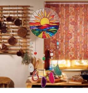 Detail of suncatcher with natural agate slices and stained glass life tree design