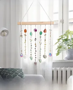 Boho crystal suncatcher with natural wood rod and hanging agate slices on metal chains