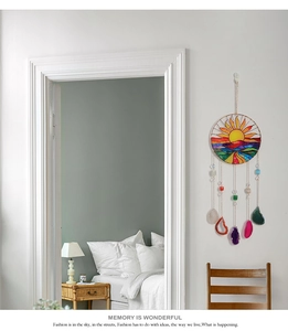 Detail of suncatcher hanging with colorful agate slices and sun patterned stained glass