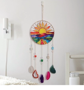 Detail of colorful acrylic suncatcher with natural agate slices and life tree beads