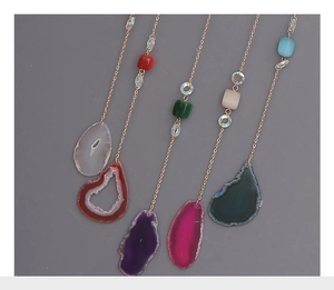 Detail showing five natural agate slice suncatchers with gold chains and square beads