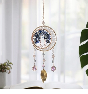 Detail of tree of life suncatcher with blue quartz and hanging purple gemstone beads