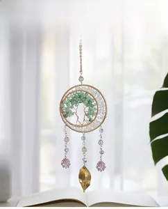 Detail of Tree of Life hanging ornament with green raw stones and purple crystal drops