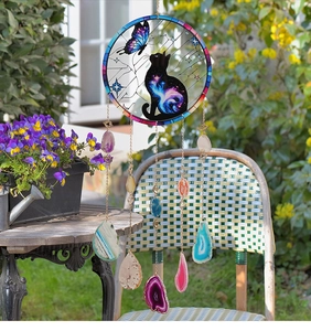 Detail of star cat suncatcher featuring natural agate slices and vibrant crystal shards