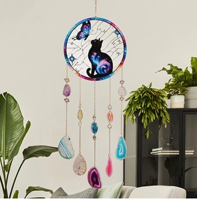 Detail of suncatcher featuring black cat design and five natural colorful agate slices