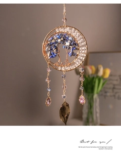 Detail of Tree of Life suncatcher with blue stones, metal leaves and purple crystals
