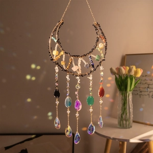 Golden crescent moon suncatcher with natural raw stones and hanging crystals